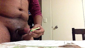 Glowstick insertion into a penis.MOV
