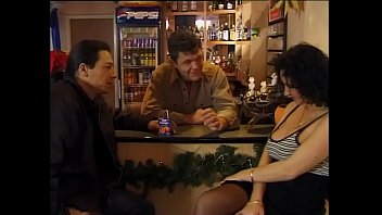 Sexy customer in black stockings fucked by two guys in a bar